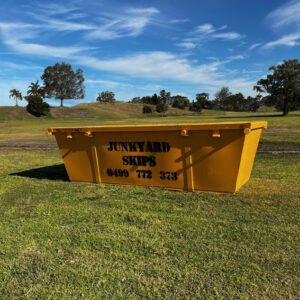 4m³ (4 cubic metre skip bin) size skip bin on grassy hill