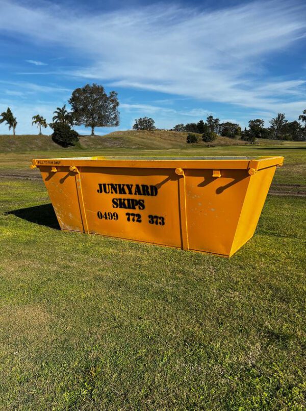 6m³ (6 cubic metre skip bin) size skip bin on grassy hill